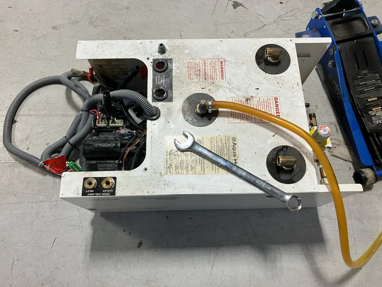 Aqua-Hot diesel hydronic heating unit removed from a motorhome for service