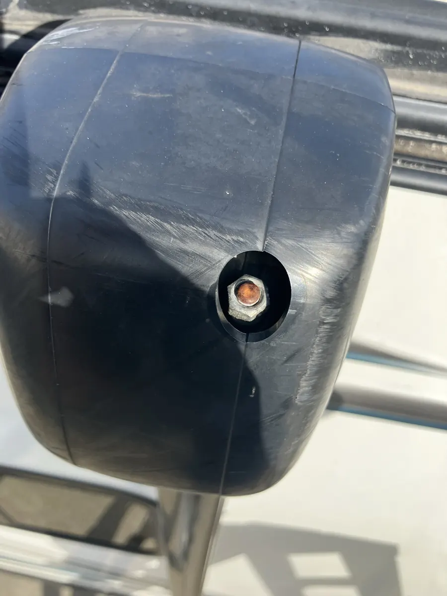 Exterior cover over the drive head of an RV power awning