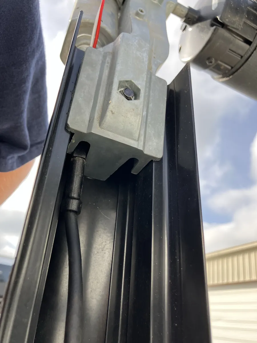 Two-wire power connector seated beside an RV power awning drive-head motor
