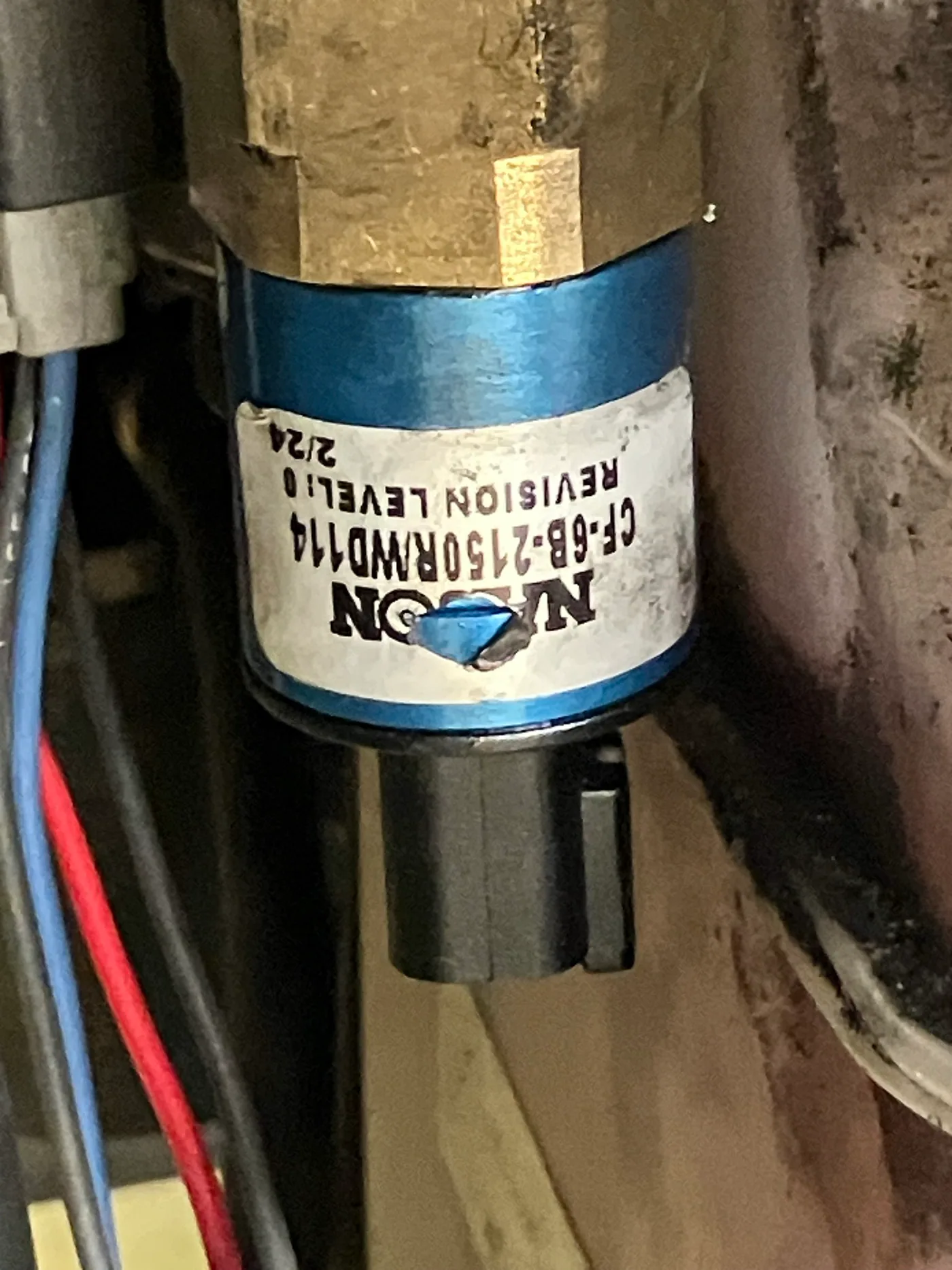 Close-up of a Nason hydraulic pressure switch on an RV leveling or slide system